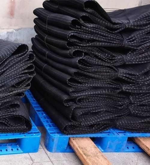 Stacks of Black Mesh on Blue Pallets